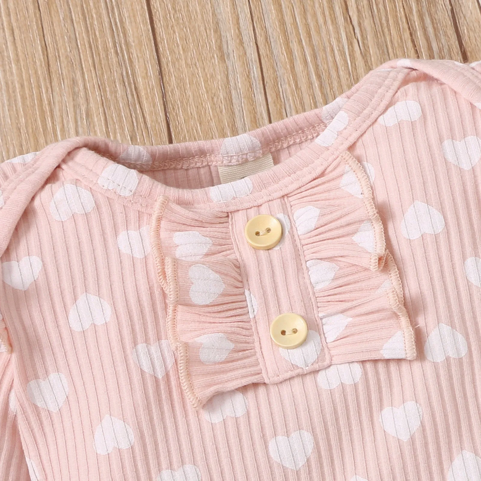 2pcs Cotton All Over Love Heart Print Baby Long-sleeve Ribbed Romper and Pants Set